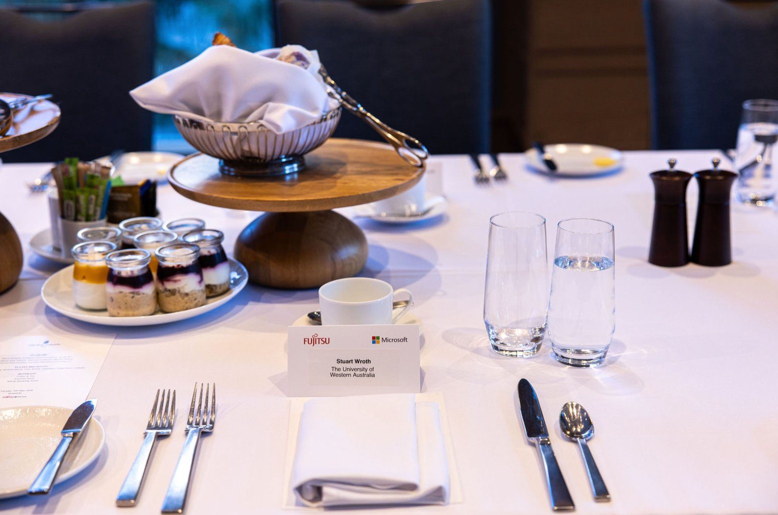 Place setting with Fujitsu and Microsoft branding at the executive breakfast